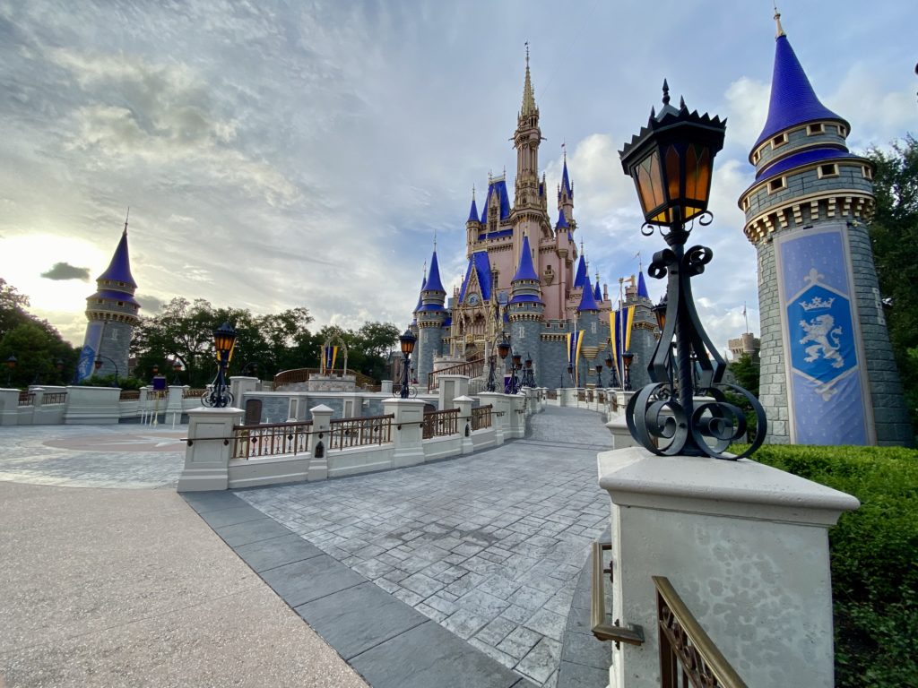 Cinderella Castle's new color scheme for the 50th Anniversary celebration - Pros and Cons of Living in Florida - by unofficialflorida.com.